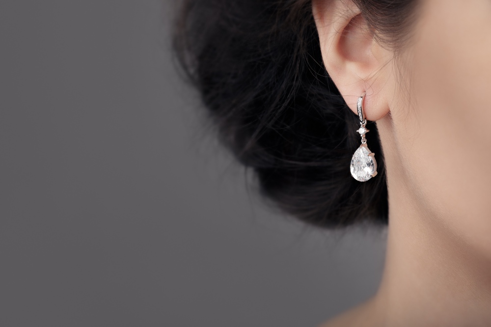 A Woman Wearing Diamond Stud Earrings in Houston, TX